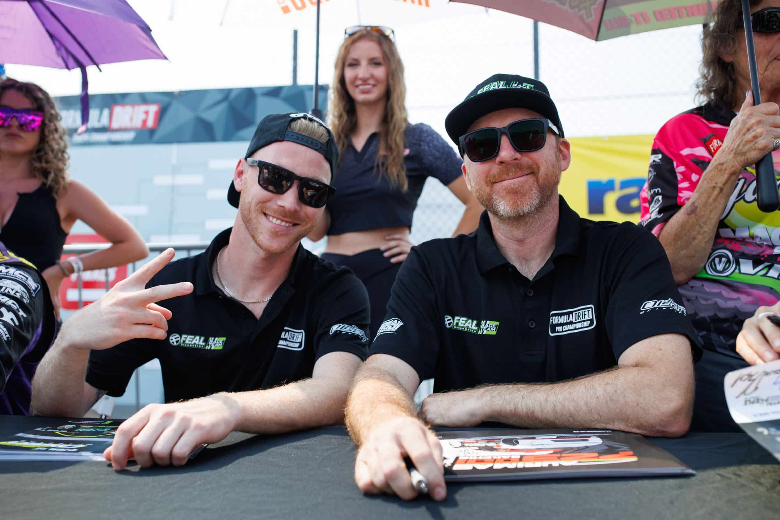 Simen Olsen and Odi Bakchis at the driver autograph session, 2024 Formula DRIFT Seattle